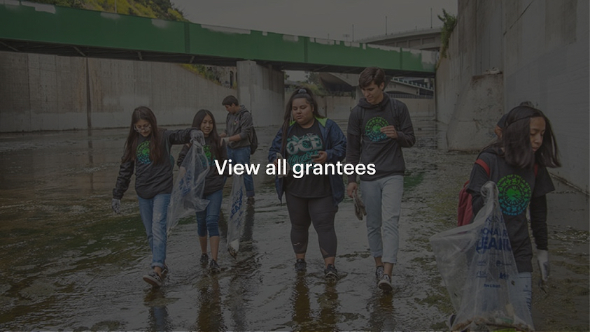 Teenagers of color picking up garbage