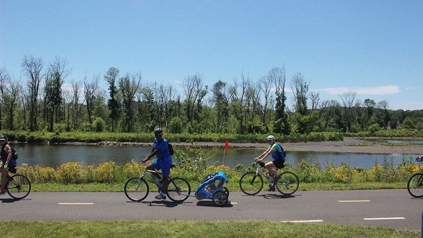 Cyclists enjoy an afternoon ride along a paved bike path near the US capital.